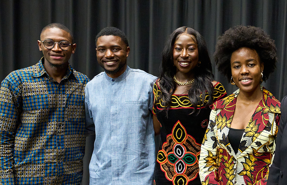 Four Yale student panelists pose in Luce Hall Auditorium