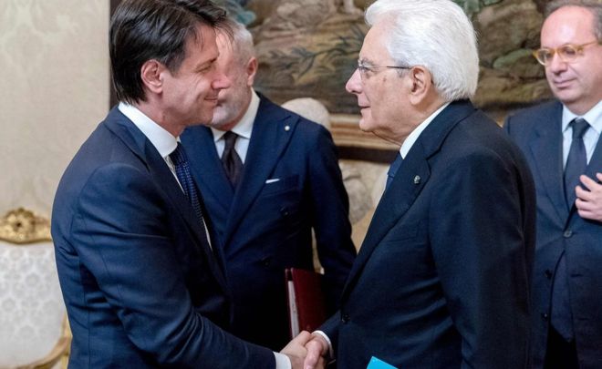 Italy’s President Sergio Mattarella (right) congratulating Prime Minister Giuseppe Conte.