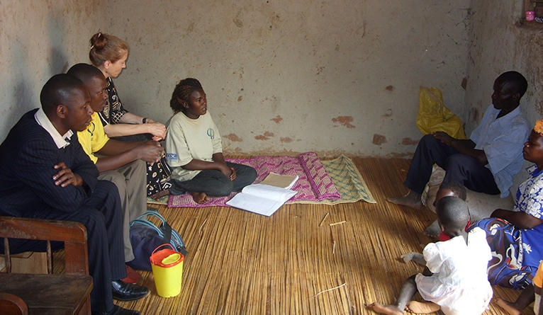 Home-based counseling and testing for an NIH-funded study in Kenya, entitled, “Reproductive Health Decisions and HIV Infection Risk.” Kurth is pictured in the back row, left. Counseling and testing in a hut with patients and clinicians