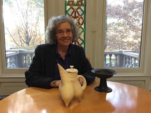 Professor Underhill with replicas of Longshan period vessels made by a Rizhao area potter: left:  gui 鬶  tripod thought to be used for heating liquids and/or soups, and right: dou 豆 stemmed dish thought to be used for serving food). 