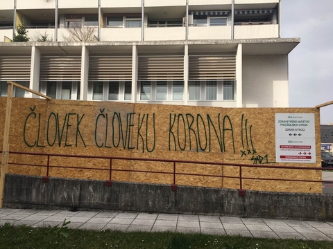 Graffiti. Ljubljana, Slovenia, March 27, 2020. »Man is Corona to Man«.