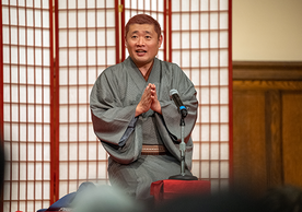 Tatekawa Shinoharu ’99 performs while kneeling at centerstage