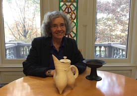 Professor Underhill with replicas of Longshan period vessels made by a Rizhao area potter: left:  gui 鬶  tripod thought to be used for heating liquids and/or soups, and right: dou 豆 stemmed dish thought to be used for serving food). 