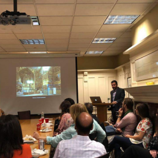 Dr. Farzin Vejdani speaking at the lecture on Middle Eastern urban history