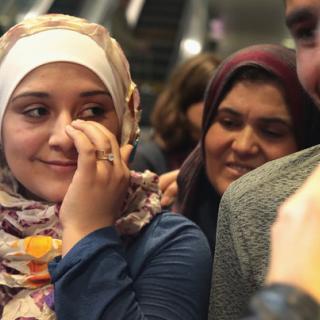Syrian refugee Baraa Haj Khalaf wipes away a tear after arriving at O’Hare Airport with her family on a flight from Istanbul, Turkey on February 7, 2017. SCOTT OLSON VIA GETTY IMAGESSyrian refugee Baraa Haj Khalaf wipes away a tear after arriving at O’Har