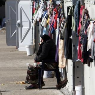 A woman smokes a cigarette at a refugee camp in Thessaloniki (AFP Photo/SAKIS MITROLIDIS)A woman smokes a cigarette at a refugee camp in Thessaloniki (AFP Photo/SAKIS MITROLIDIS)