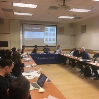 conference attendees sitting around a conference table