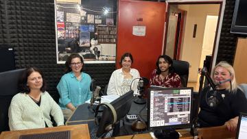 Students being interviewed at a radio station