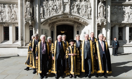 The justices of the UK Supreme Court in front of the Middlesex Guildhall where the Court is located.