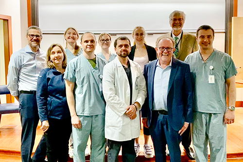 Doctors pose for a group photo at Yale School of Public Health